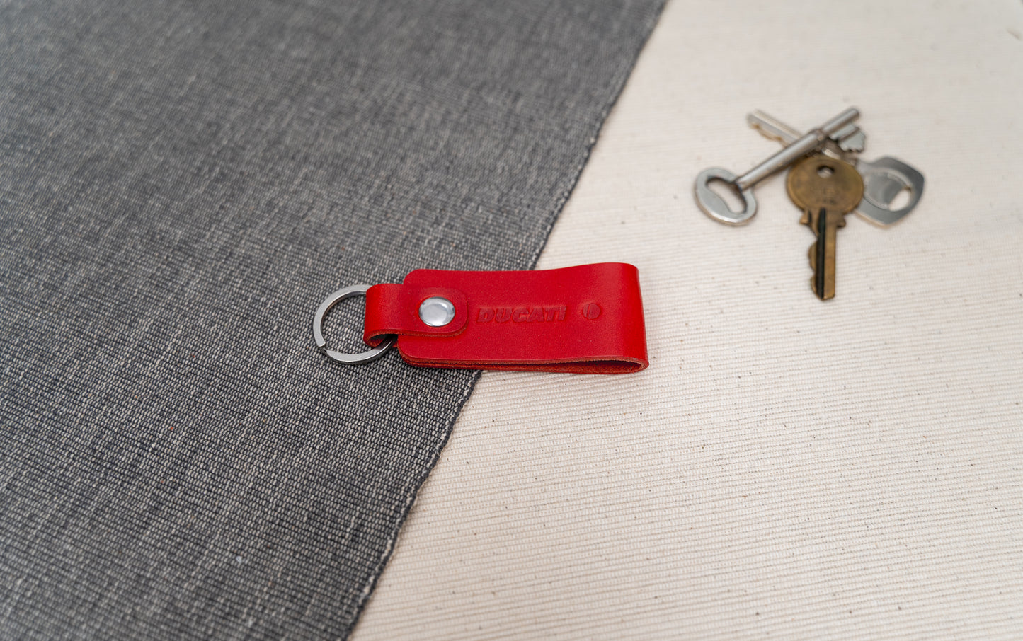 Ducati text logo leather keychain in and leather with stainless steel hardware