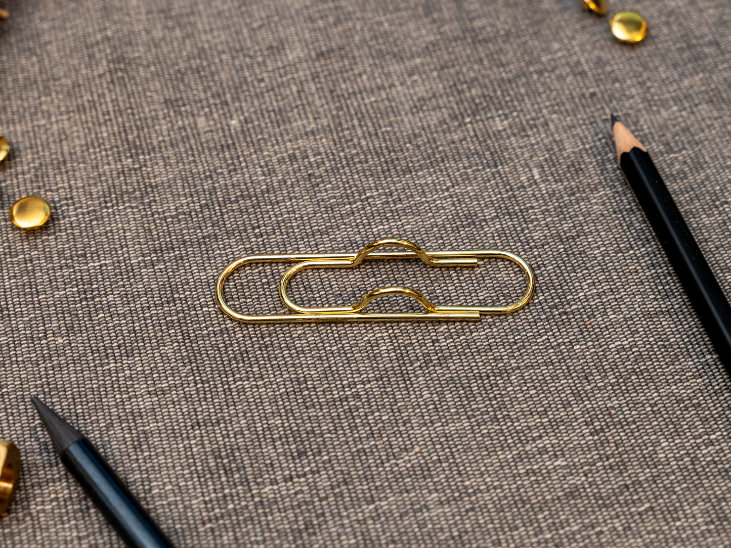 Gold notebook pen clip in that looks like a paperclip