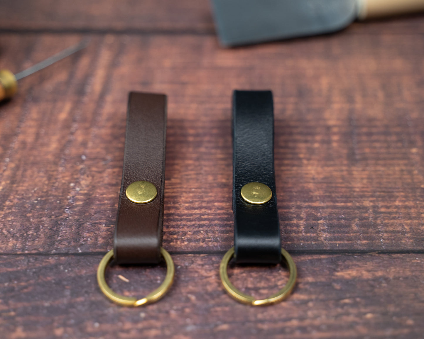 Dark brown and black leather looped keyrings side by side