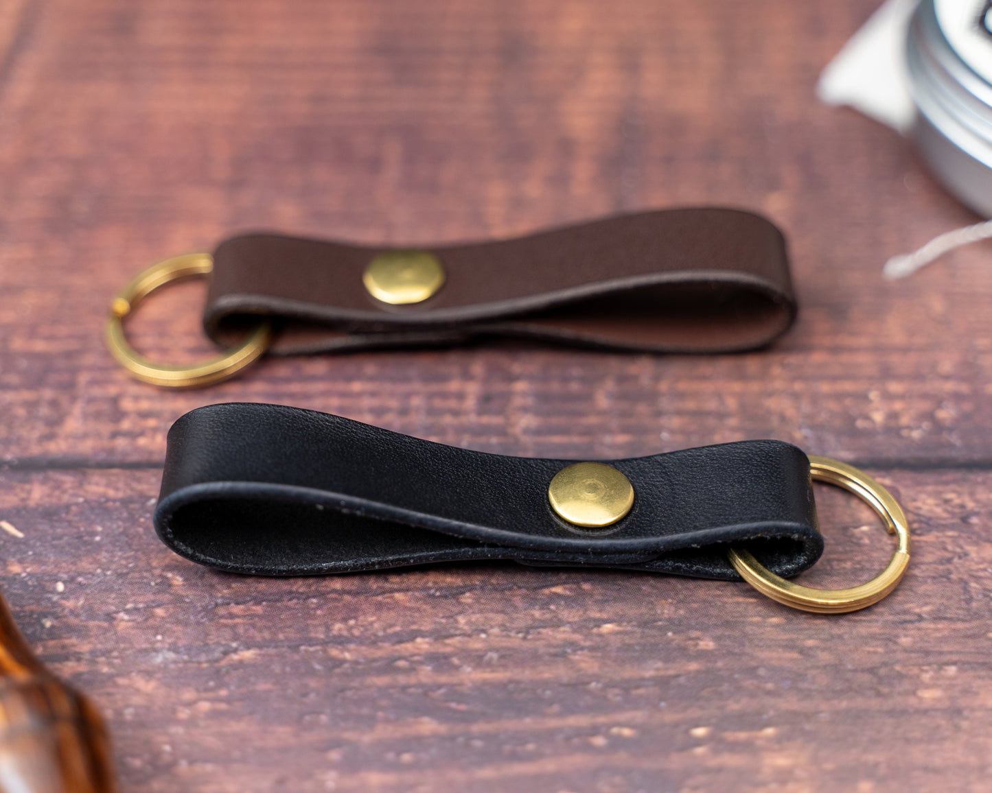 Dark brown and black leather keyrings side by side