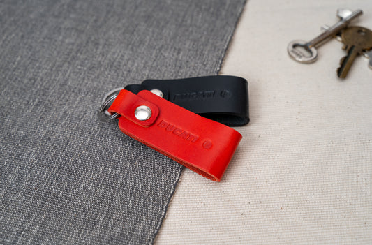 Two Ducati text logo leather keychains in black and red leather with stainless steel hardwarehardware