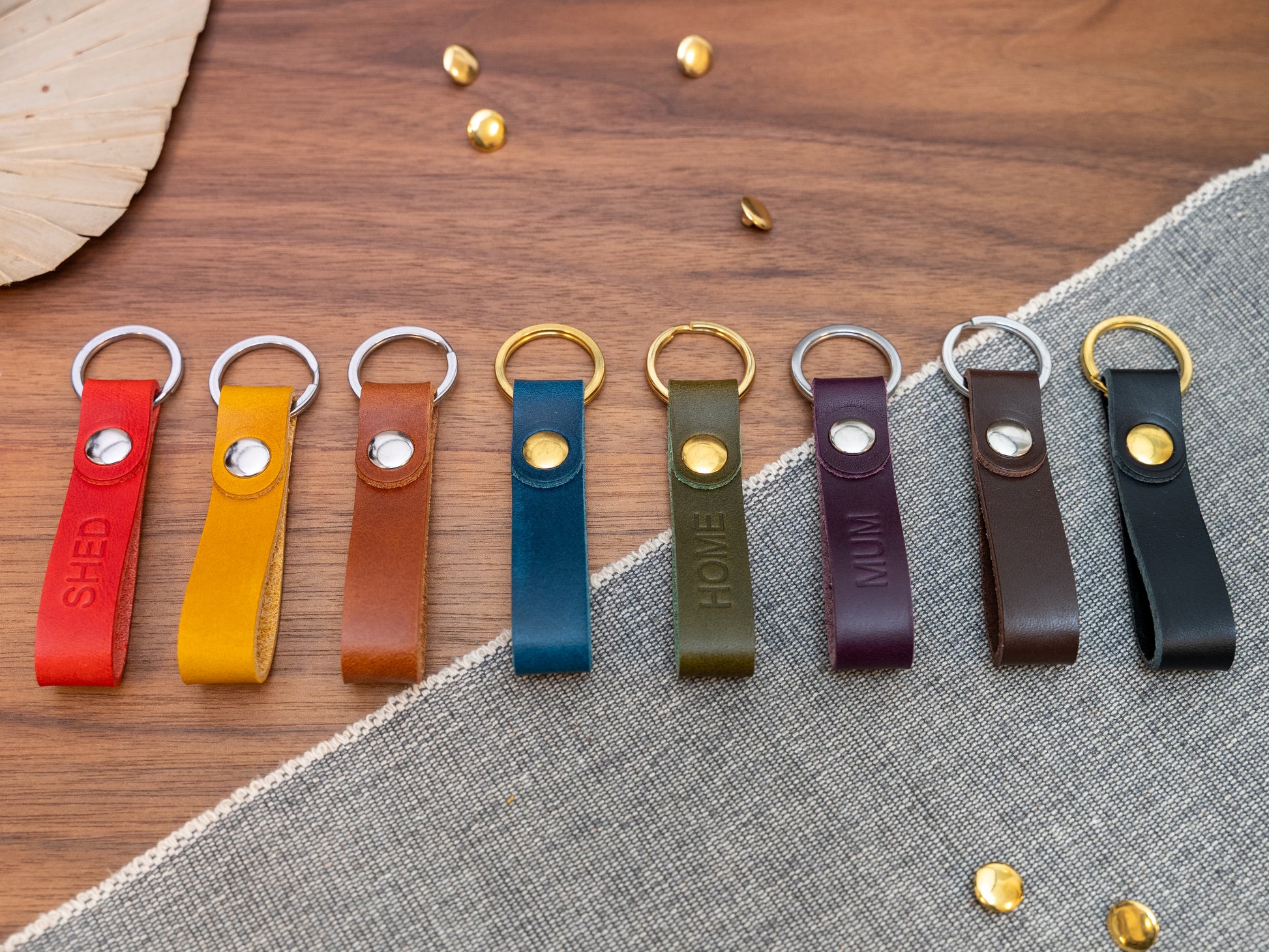 Slim Italian leather loop keyrings/keychains in multiple colours including black, brown, purple, olive green, navy blue, tan, yellow and red. Personalised with up to 6 letter debossed into the leather. Stainless steel or solid brass split ring and rivet.