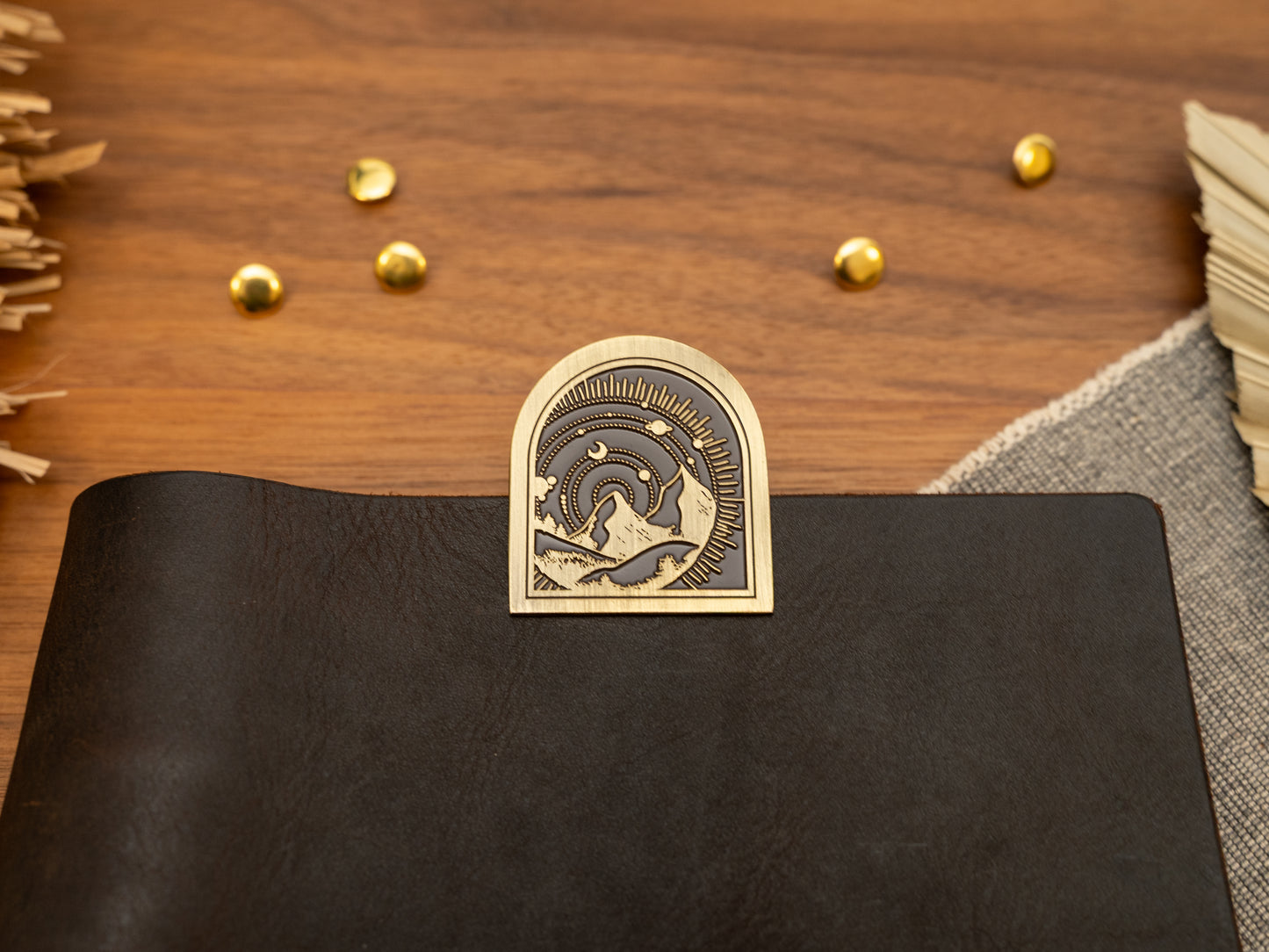 Vintage antique brass metal journal book clips with a mountain with solar system background design
