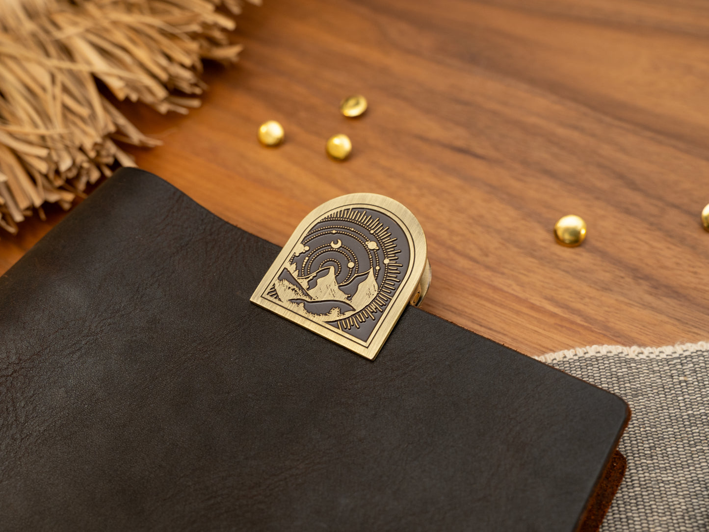 Vintage antique brass metal journal book clips with a mountain with solar system background design