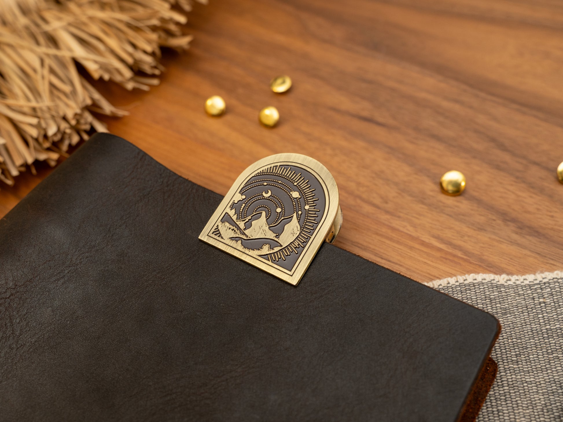 Vintage antique brass metal journal book clips with a mountain with solar system background design