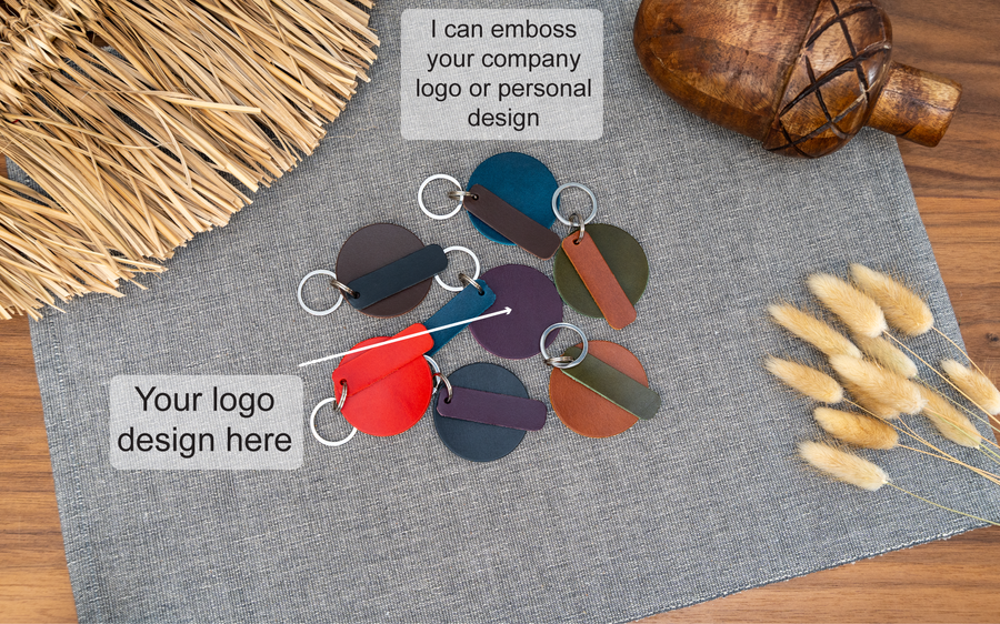 Mixture of round blank keyrings with rectangular tab that can be personalised in black, tan, olive green, purple, red, navy blue and dark brown. Can be stamped with custom logos such as car logos, company logos. Available in several colours with stainless steel or brass hardware.